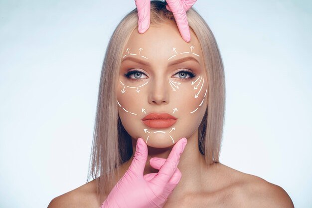 caucasian-beautiful-female-face-marked-with-arrows-main-facial-lifting-lines_93675-116979